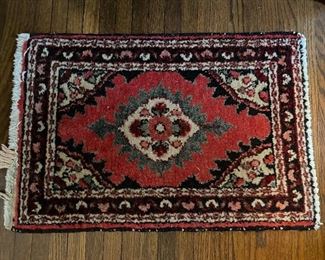 Small Oriental rug or table runner.