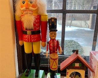 German nutcracker (left); Russian drummer figurine (center).