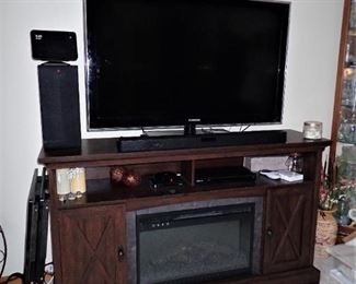 TV - SOUND BAR - ENTERTAINMENT CENTER WITH BUILT IN FIREPLACE