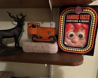 some vintage toys - a deer bank on the left,                              a cool looking rod vehicle in the middle      and                        in it's original Ben Cooper box Raggedy Andy costume