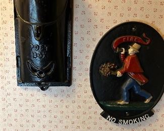 Vintage cast iron mail box and Fireman’s plaque