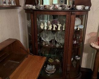 an excellent china cabinet with many great pcs of glassware, left side shows a drop down writing desk.