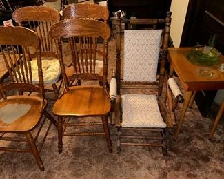 set of 4 spindel back/pressed back chairs, a platform rocker, a side table and there are some green (uranium) dishes on the right.