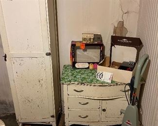 on the left - chimney cabinet                                                              center - three drawer, 1 door commode                                      View Master, View Master Projector kit with a Disney cover,  Screenette, Donald Duck, Goofy and other view Master discs.    lower right - Bissell Quicksteamer                