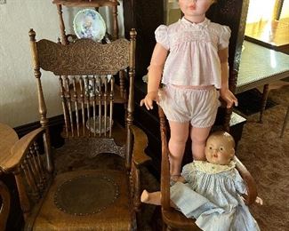 Very nice rocker, corner ‘whatnot’ shelf behind, two antique dolls (the tall one will walk with you & it’s from the early 60s) and of the child’s highchair.