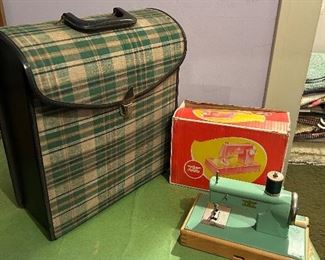 On the left - a Columbia Record company record holder carrying case. On the right - a Casige toy sewing machine from west Germany.