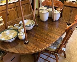 A marriage of a ‘newer’ round kitchen table with one leaf and an antique claw footed oak base. Pfaltzcraft 4 canister set, nest of Pfaltzcraft bowls and creamer & sugars, vegetable serving dish and salt & pepper set.