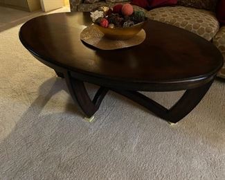 . . . a nice oval coffee table in dark tone