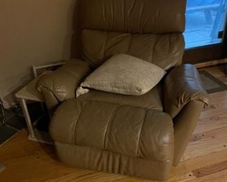 . . . a beige-colored leather recliner