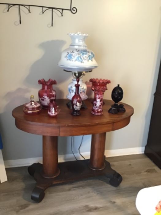 Empire oval library table, Mary Gregory pieces and Gone with the Wind lamp