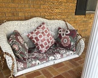 Vintage wicker swing with cushions and chain