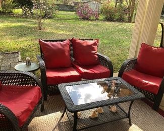 4 piece synthetic wicker set with cushions. Outdoor rug measures 5 x 7