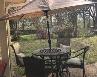Bar high outdoor table with 4  chairs and umbrella. 