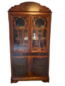 $1200 USD       Stunning Wooden Cabinet/Hutch w/Ornate Mullion Glass Doors GW164-17      Description: Stunning Wooden cabinet that wood be eye catching in any room. Exquisite mullions design hiding 2 glass shelves. This gorgeous piece provides plenty of storage behind four doors which all open smoothly.  The piece stands regally above acanthus carved feet.
Dimension: 18.5 x 36 x 72"H in
Condition: Excellent. Please refer to photographs.
Location: Local pick up Falls Church VA.  Please contact us for shipping suggestions.      https://goodbyhello.com/products/stunning-wooden-cabinet-with-ornate-glass-and-wood-doors-gw164-17?_pos=14&_sid=3405cb80f&_ss=r