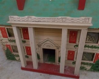 Particle board vintage doll house decorated for Christmas