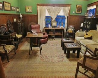 The rug, the two bookcases, and 2 chairs on the left are gone; rest is avail.