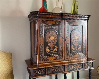 Alfonso Marina China cabinet
Exquisite inlaid wood with the Spanish lions on the front and white cedar lines on the inside.  It smells delicious!