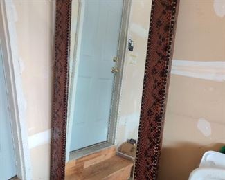 This mirror is wrapped in faux snake skin and is approx  6' tall by 3' wide