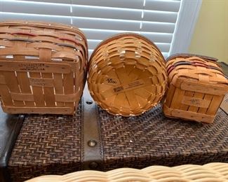 #94	longaberger basket  3 small baskets (2) with handles 1 w/ red green strips 	 $40.00 
