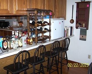 Four bentwood stools, small Haier refrigerator, wine rack, wall shelf,  cookbooks and more