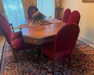 . . . this table and chairs matches the sideboard and china hutch -- owner is undecided on this piece