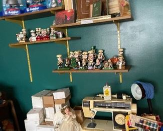 1 wall of the craft room. Hersheys Collection and sewing machine. 