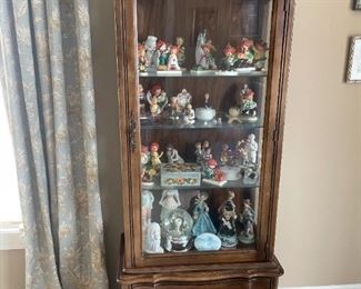 . . . nice curio cabinet filled with treasures -- Hummels and more!