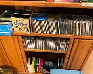 CD’s, DVD’s, VHS and more in entertainment center in living room