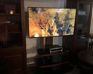 55 Vizio tv with entertainment center with glass doors and shelves