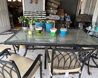 Glass table outdoor patio with 6 chairs and pads