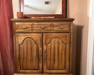 Armoire with top drawer 2 cabinet doors with 6 compartments and 2 bottom drawers: Measurements are 38" long x 55 1/2" tall 