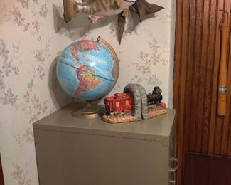 taxidermy fish, globe, train bookends, file cabinet 