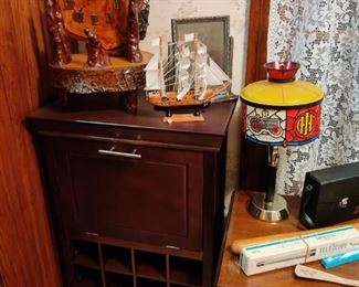 office organization station, model pirate ship, steam engine themed lamp, wood carved clock