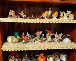 ceramic ducks, birds, geese, and snow globes