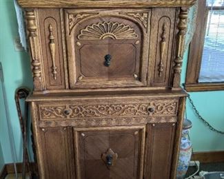 Ornate antique storage cabinet