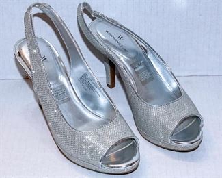 THREE RACKS of Lady's clothing