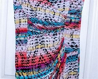 THREE RACKS of Lady's clothing