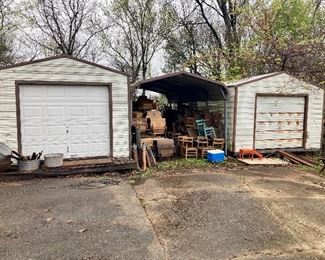 These two 12’ x 28’ sheds and one carport are full of stuff and are for sale