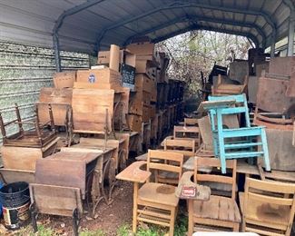 Hundreds of antique iron and wood school desks