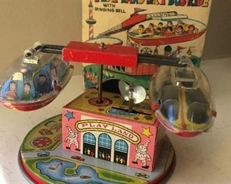 $100 - 1960’s Japanese tin toy with box winds up and spins