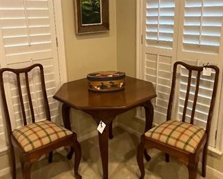 Octagonal Game Table and two antique side chairs.