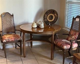 Vintage Round Game Table. Two vintage side chairs.