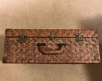 Wicker suitcase.