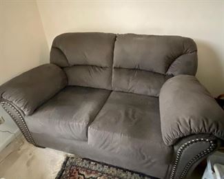BUY IT NOW $100. Plush Smoke Gray loveseat with studded arms, by Ashley. 