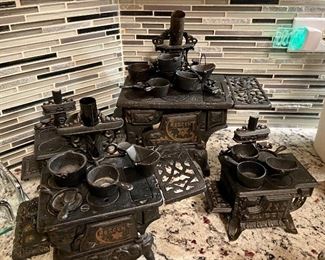 Antique Crescent Star Toy Salesman's Sample cast iron stoves with pots & pans; assorted sizes