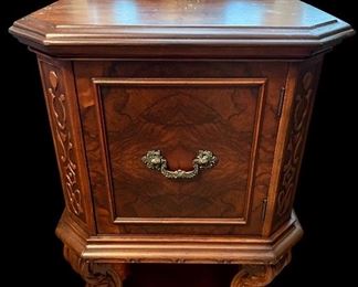 Antique wood night table with click/intricate wood carving.
