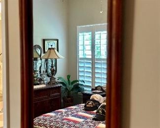 Hanging wood frame mirror.