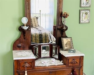 Antique Eastlake style vanity with marble top.