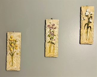 Three Cheri Blum floral wall hangings
