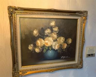 floral art with ornate wood frame